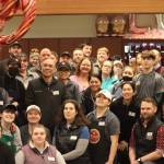 Safeway employees and store managers pose for a group photo on Wednesday after a grand reopening ceremony was held to celebrate the completion of many remodeling projects. (Jonson Kuhn / Juneau Empire)