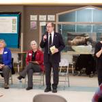 Mark Sabbatini / Juneau Empire 
Juneau state Sen. Jesse Kiehl addresses a town hall audience Wednesday evening at Dzantiki Heeni Middle School as Anita Evans provides a sign language interpretation for the live and online audience. Juneau state Reps. Sarah Hannan, far left, and Andi Story also answered questions from the roughly 25 people attending the meeting.