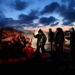 Fredrick Brower, center, helps cut up a bowhead whale caught by Inupiat subsistence hunters on a field near Barrow, Alaska, Oc. 7, 2014. After tidal surges and high winds from the remnants of a rare typhoon caused extensive flood damage to homes along Alaska's western coast in September, the U.S. government stepped in to help residents largely Alaska Natives repair property damage. Residents who opened Federal Emergency Management Agency brochures expecting to find instructions on how to file for aid in Alaska Native languages like Yup'ik or Inupiaq instead were reading nonsensical phrases. (AP Photo / Gregory Bull)