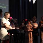 Kat Moore and a group of volunteer singers sang mid way through the Alaska Music Summit on Saturday at the Juneau Arts and Culture Center. Moore was a speaker and performer at the event who traveled from Anchorage to attend. (Clarise Larson / Juneau Empire)