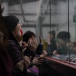 A fan shout during the overtime period at the Juneau-Douglas High School: Yadaa.at Kalé Crimson Bears hockey game against the Soldotna High School Stars on Saturday. (Clarise Larson / Juneau Empire)