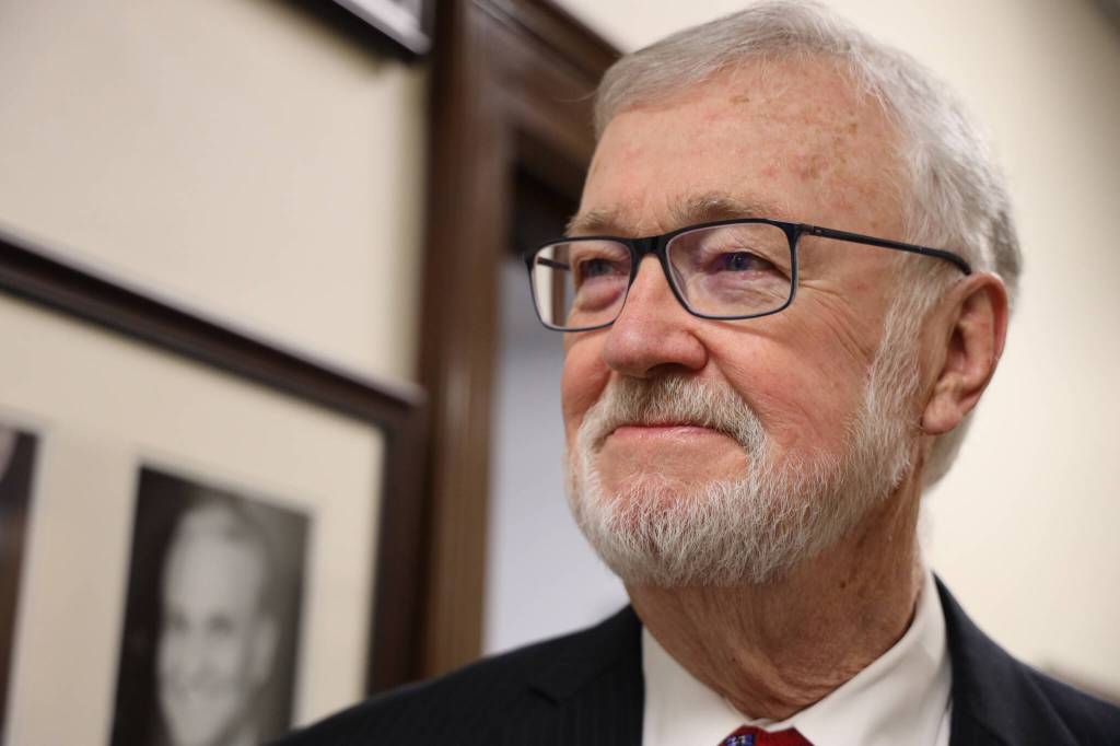 Alaska Senate President Gary Stevens, R-Kodiak, stands near his portrait in a hallway of the Alaska State Capitol. On the first day of the legislative session, Stevens, who will preside over a body with a bipartisan majority, spoke about the importance of cooperation. (Clarise Larson / Juneau Empire)