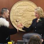 State Rep. Josiah Patkotak, I-Utqiaġvik, left, accepts the gavel from Lt. Gov. Nancy Dahlstrom after being elected speaker pro tem of the House during the opening day of the 33rd Alaska State Legislature on Tuesday. Patkotak, who has served as president pro tem during a previous stalemate in determining a House majority, is among the members Republicans are trying to lure to join a coalition controlled by their party. (Mark Sabbatini / Juneau Empire)