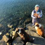 Vivian Faith Prescott, accompanied by dogs Kéet and Oscar, holds Alaska’s literary journals in Wrangell. (Courtesy Photo / Vivian Faith Prescott)