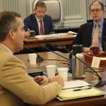 State Sen. Jesse Kiehl, D-Juneau, right, listens to an overview of Alaskas past and projected oil production by Department of Natural Resources Commissioner John Boyle during Kiehls first meeting as a member of the Senate Finance Committee on Wednesday. (Mark Sabbatini / Juneau Empire)