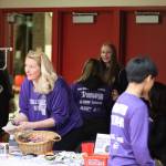 Melissa McCormick and volunteers with nonprofit Find Your Fire hands out T-shirts and swag for the JDHS annual Suicide Prevention Awareness game Wednesday night. McCormick also gave a speech at halftime about the importance of mental health and tossed shirts into the crowd. (Jonson Kuhn / Juneau Empire)