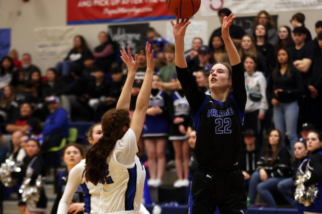 TMHS Kerra Baxter shoots over her defender during a Friday night home win against Palmer. Baxter finished the game with a team-leading 20 points. (Ben Hohenstatt / Juneau empire)
