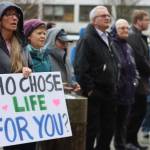 Shannen Greene holds a sign at the Alaska State Capitol during Mondays anti-abortion rally held by Alaskans for Life Inc. (Jonson Kuhn / Juneau Empire)