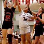 Juneaus Ashley Laudert (25), Kayhis Kylie Brendible (32), and Juneaus Mila Hargrave (24) go up for a rebound on Friday at Ketchikan High School. Juneau won 40-33. (Christopher Mullen / Ketchikan Daily News)