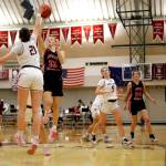 Kayhis Lindsay Byron (21) tries to block Juneaus Skylar Tuckwood (13) as she attempts a layup Friday at Ketchikan High School. Juneau won 40 to 33. Photo by Christopher Mullen Ketchikan Daily News
