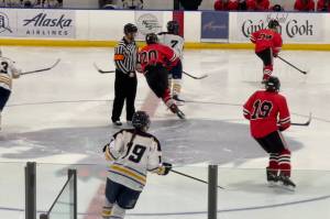 Juneau-Douglas High School: Yadaa.at Kalé Crimson Bears hockey team played against Houston High Schools Hawks Friday evening at Houstons home, one of three weekend of away games for the team. (Courtesy / Judy Campbell)