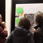 Carrie Connaker with Solstice Alaska Consulting meets with Juneau residents during an open house at the Mendenhall Glacier Visitor Center on Tuesday to help explain alternatives currently being proposed for the recreation area. (Jonson Kuhn / Juneau Empire)