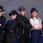 Dane Hubert, Fredrik Hale Thorsteinson IV, Casey Knapp, Alexis Juergens and Finley Hightower, the Fedora Squad, pose for a photo during the Region V Drama, Debate and Forensics Tournament. (Ben Hohenstatt / Juneau Empire)