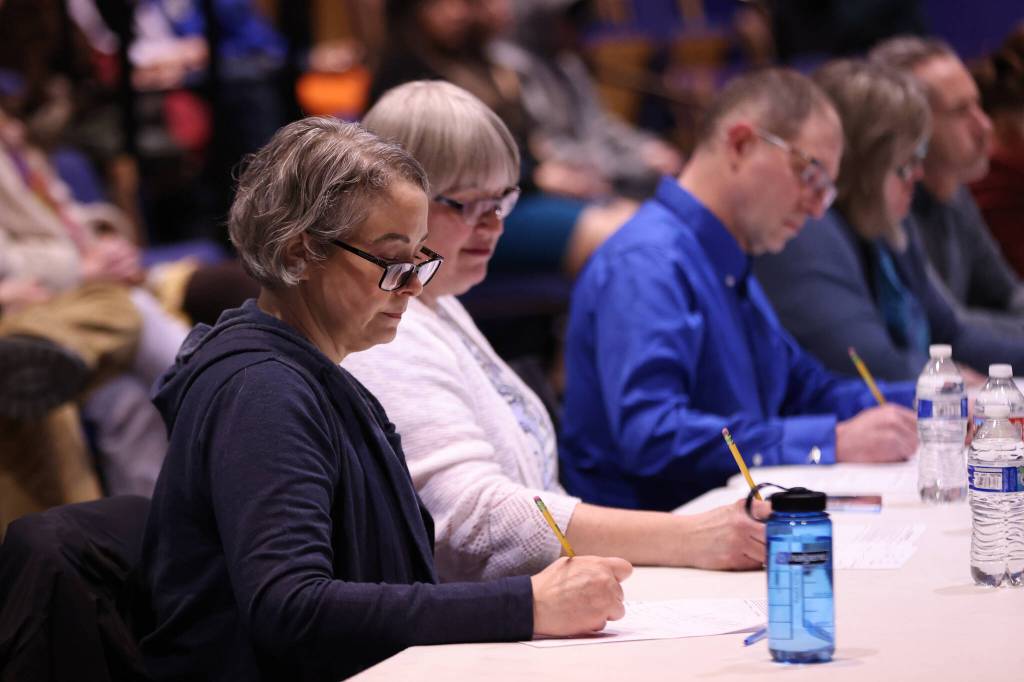 Judge Amy Mead, Mayor Beth Weldon, state Sen. Jesse Kiehl, state Rep. Sara Hannan and former University of Alaska Southeast professor Chip McMillan evaluate the final public forum debate between between Felix Myers and Jamison Dunn of Sitka and Killian Connolly and Kate Thomas of Ketchikan. (Ben Hohenstatt / Juneau Empire)