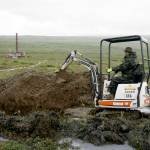 A worker with the Pebble Mine project digs in the Bristol Bay region of Alaska near the village of Iliamma, Alaska, July 13, 2007. The U.S. Environmental Protection Agency announced a decision Tuesday, Jan. 31, 2023, that would block plans for the proposed Pebble Mine, a copper and gold project in southwest Alaska. (AP Photo / Al Grillo)