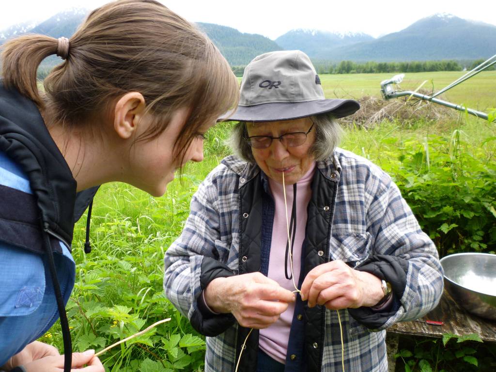 Courtesy Photo / King family 
Mary Lou King shows her granddaughter how to split spruce roots.