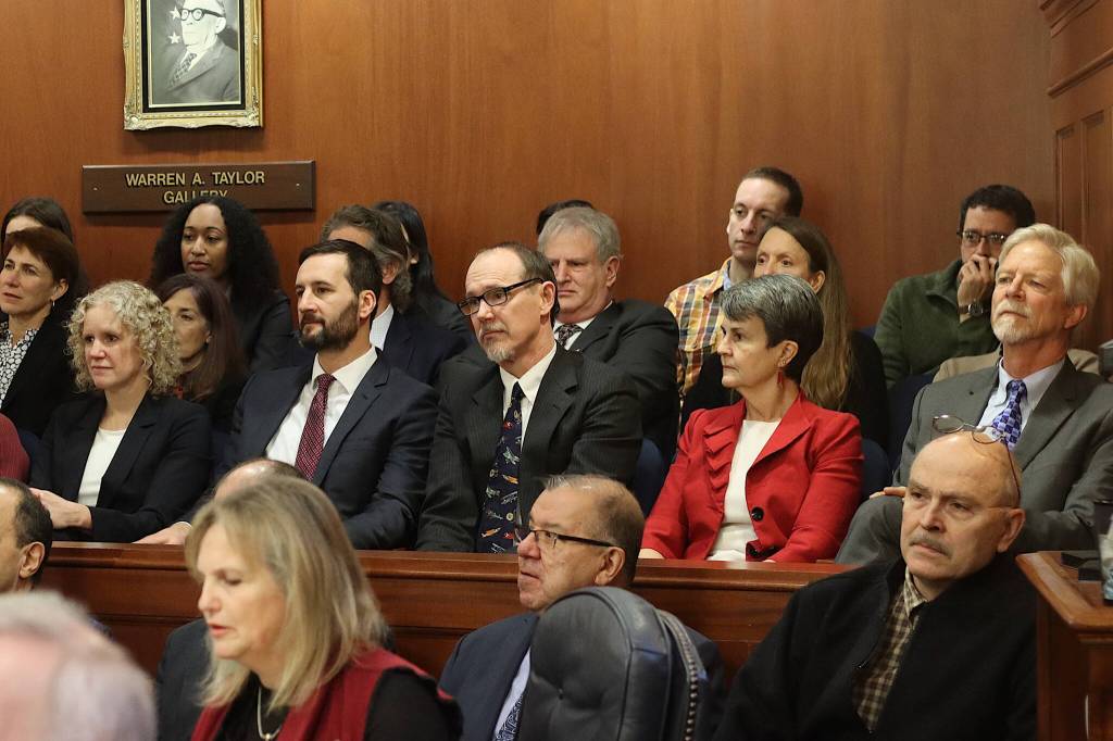 The four justices of the Alaska Supreme Court besides Chief Justice Daniel Winfree, including his successor Peter Maassen (at right in front row of audience section), plus new justice nominee Jude Pate (center) listen to Winfrees State of the Judiciary Speech on Wednesday. Numerous other top staff with the court system were also in the audience. (Mark Sabbatini / Juneau Empire)