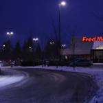 A vehicle exits the Juneau Fred Meyer parking lot on Wednesday. Juneau Police Department is investigating a report of a threat made against the store. (Ben Hohenstatt / Juneau Empire)