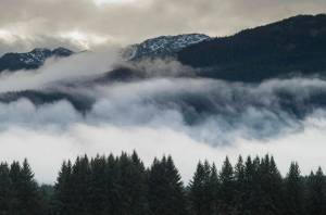 In this Nov. 29, 2018 photo, clouds swirl over Douglas Island. (Michael Penn / Juneau Empire File)
