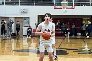 JDHS senior Kai Hargrave sets up to take the first of two free throw shots with 1.7 seconds left in Wednesday nights game against Thunder Mountain High School. Hargraves last second shot secured the win for the Crimson Bears in their first conference game of the season. (Jonson Kuhn / Juneau Empire)