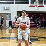 JDHS senior Kai Hargrave sets up to take the first of two free throw shots with 1.7 seconds left in Wednesday nights game against Thunder Mountain High School. Hargraves last second shot secured the win for the Crimson Bears in their first conference game of the season. (Jonson Kuhn / Juneau Empire)