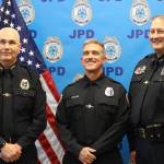 Officer William Hicks stands with JPD Chief Ed Mercer and Deputy Chief David Campbell during a swearing in ceremony for Hicks on Thursday at the JPD station in Lemon Creek. (Jonson Kuhn / Juneau Empire)