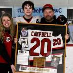 The Campbell family poses for a photo in Treadwell Arena during the last Crimson Bears home hockey game of the season. (Courtesy Photo)