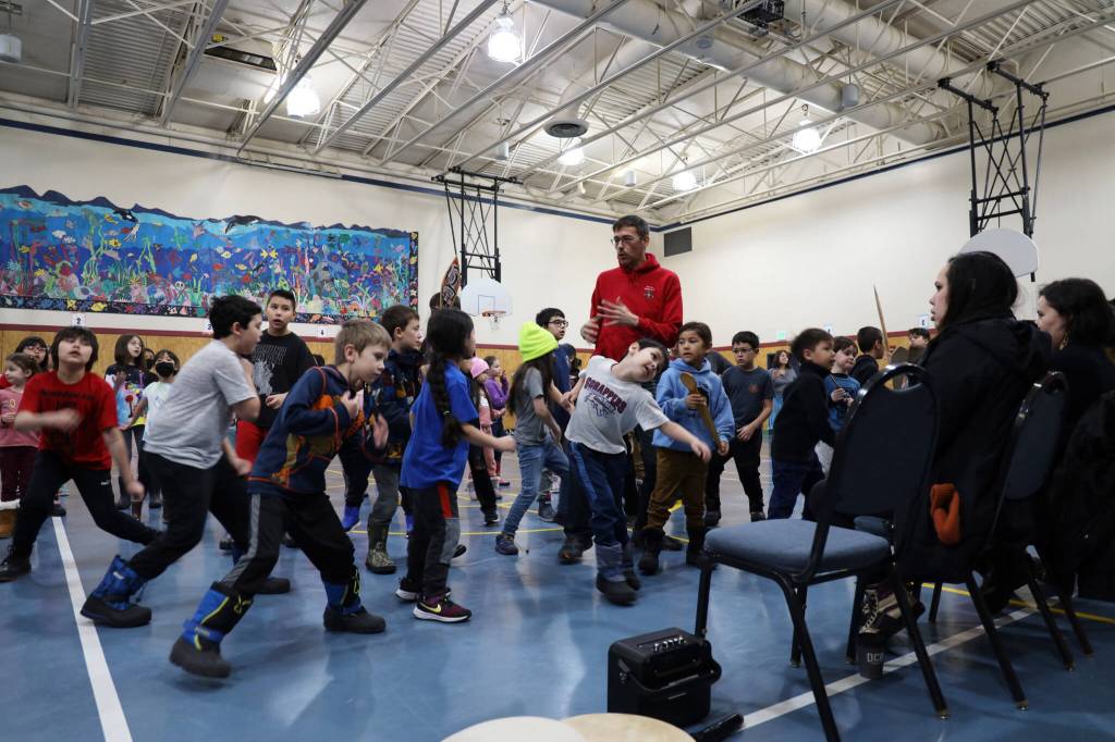 Students from the Tlingit Culture Language and Literacy program at Harborview Elementary School dance in front of elders during the programs Monday morning meeting. (Clarise Larson / Juneau Empire)