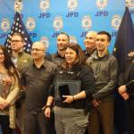 Members of the Juneau Police Department pose for a group photo during the annual JPD awards ceremony on Monday. (Jonson Kuhn / Juneau Empire)