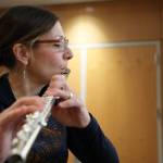 Sally Schlichting practices the flute at the Alaska State Library, Archives and Museum Atrium Monday afternoon in preparation for her upcoming solo concert Saturday afternoon. (Clarise Larson / Juneau Empire)