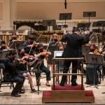 The Juneau student ensemble Aurora Strings warm up on the stage at Carnegie Hall before their 30-minute performance as part of the Sounds of Summer International Music Festival in June of last year. (Photo courtesy of World Projects)