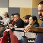 During a Wednesday rehearsal at KTOO studios for the Alaska Theater Festival: Radio Plays, Shaakindustoow Ed Littlefield, seen here, is joined by the cast of Vera Starbards, The Beginning of Eagle which is an adaptation from stories shared by DaaXKu dein Tommy Jimmie. The Beginning of Eagle will be performed Saturday live in-person at KTOO studios as well as on-air at KTOO News 104.3 and 91.7, and online at ktoo.org/listen. (Jonson Kuhn / Juneau Empire)