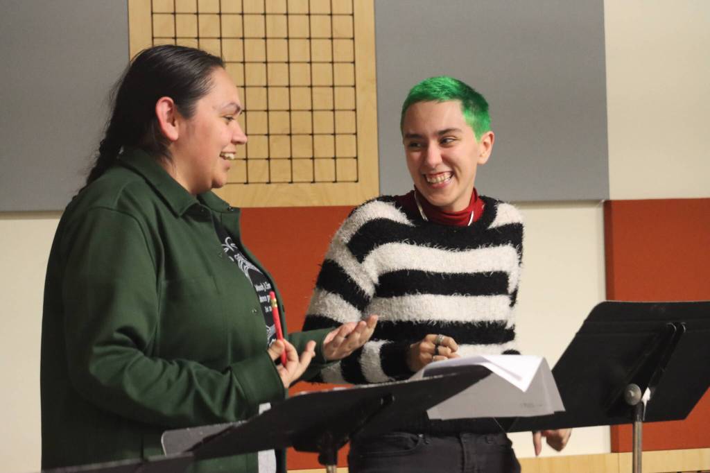 Xáalnook Erin Tripp and Jay Zeller practice lines during a Wednesday night rehearsal at KTOO Studios of Frank Henry Kaash Katasses newest play, Reeling, which will be performed in-person and on-air on Saturday at KTOO Radio Station as part of the Alaska Theater Festival: Radio Plays. (Jonson Kuhn / Juneau Empire)