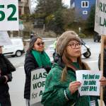 Participants hold signs and chant supportive slogans during a rally for state employees on Friday in front of the Alaska State Capitol. (Mark Sabbatini / Juneau Empire)