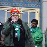 Joey Tillson, a state Division of Public Assistance employee in Ketchikan, addresses a state employees rally while wearing what she called a warrior hat in front of the Alaska State Capitol on Friday. Participants are trying to convince lawmakers to remedy staffing shortages allegedly caused by problems such as poor wages and poor treatment. (Mark Sabbatini / Juneau Empire)
