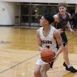 JDHS junior Alwen Carrillo sets up for a 3-point shot against Ketchikan High School on Saturday night. Carrillo would finish the game with a total of 20 points. (Jonson Kuhn / Juneau Empire)