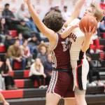 JDHS junior Sean Oliver puts up a tricky lay up against Ketchikan High School during a conference game Friday night. Oliver was second in leading his team in scores for a total of 16 points. (Jonson Kuhn / Juneau Empire)