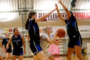 Thunder Mountains Cailynn Baxter (23) and Kiara Endicott (14) guard Ketchikans Kali MacManus (1) during Saturdays game at Ketchikan High School, which Thunder Mountain won 60-38. (Christopher Mullen / Ketchikan Daily News)