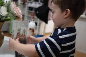Clarise Larson / Juneau Empire 
Claes Schneider holds a picture of his grandmother, Tracy Lynn Day, right, who has been missing since Feb. 14 2019.