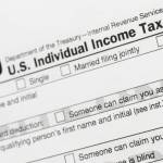 This July 24, 2018, file photo shows a portion of the 1040 U.S. Individual Income Tax Return form. (AP Photo / Mark Lennihan File)