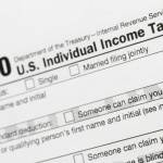 This July 24, 2018, file photo shows a portion of the 1040 U.S. Individual Income Tax Return form. (AP Photo / Mark Lennihan File)
