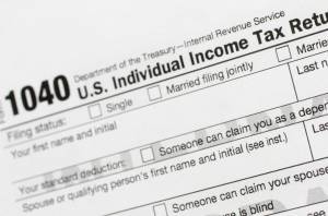This July 24, 2018, file photo shows a portion of the 1040 U.S. Individual Income Tax Return form. (AP Photo / Mark Lennihan File)