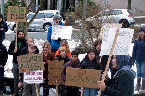 People rally in support of renewable energy policies, such as strengthening a renewable energy fund, across from the Alaska Capitol on Friday, Feb. 3, 2023, in Juneau, Alaska. Some environmentalists are skeptical of legislation proposed by Gov. Mike Dunleavy that aims to capitalize on carbon storage and carbon markets. (AP Photo / Becky Bohrer)