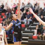 TMHS junior Mikah Caradang puts up a 3-point shot in the second quarter Tuesday night during a conference game against JDHS. Caradang would finish the game with a total of 6 points. (Jonson Kuhn / Juneau Empire)