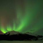 Michael Penn / Juneau Empire File
The Aurora Borealis glows over the Mendenhall Glacier in 2014.