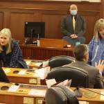Juneau state Reps. Andi Story, left, and Sara Hannan wear kuspuks while talking with fellow House members just before U.S. Rep. Mary Peltolas first speech as a congresswoman to a joint session of the Alaska State Legislature on Friday. (Mark Sabbatini / Juneau Empire)