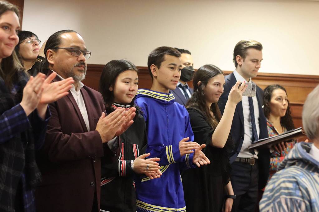 Family and staff of U.S. Rep. Mary Peltola stand and applaud as she enters the House chambers Friday to deliver her speech to a joint session of the Alaska State Legislature. Two of her children are currently high school students in Juneau. (Mark Sabbatini / Juneau Empire)