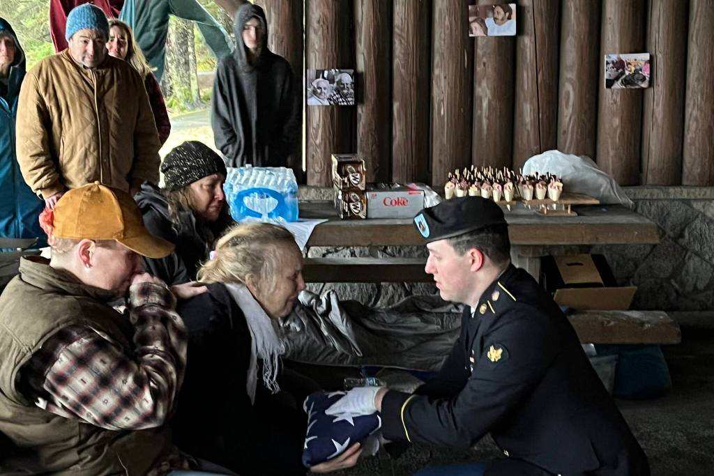 Lavena Sargent is presented a flag during her late husbands memorial service on Saturday at Auke Bay Recreation Area. Daniel was a Vietnam Veteran and had been retired from the Alaska Marine Highway System for 20 years. (Jonson Kuhn / Juneau Empire)