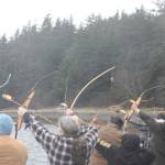 Family and friends of Daniel Sargent shoot flaming arrows into Auke Bay on Saturday during Sargents memorial at Raven Shelter. Sargent was one of the founding members of the Juneau Archery Club and was survived by his wife Lavena and daughter Tiffany Sargent Hallquist. (Jonson Kuhn / Juneau Empire)
