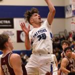 TMHS junior Thomas Baxter (30) takes a tough shot in traffic late in a Friday night 64-59 win against Ketchikan High School. Before the game, Baxter was honored for breaking the 1,000-point mark. Hes the fastest-ever Falcon to do so, and now sits at No. 3 on the schools all-time scoring list. He finished Fridays game with 25 points. (Ben Hohenstatt / Juneau Empire)
